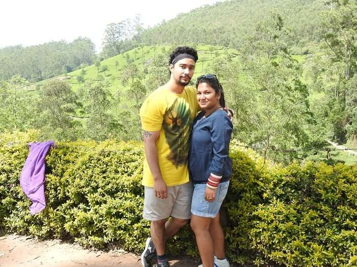 pooja and her husband at tea garden in munnar