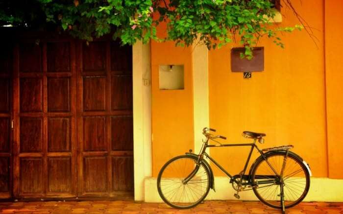 A bicycle parked outside a house in Pondicherry
