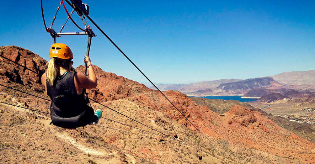 a girl zip lining in grand canyon