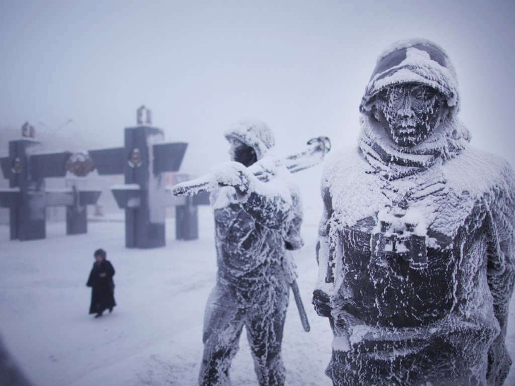 statues covered in snow