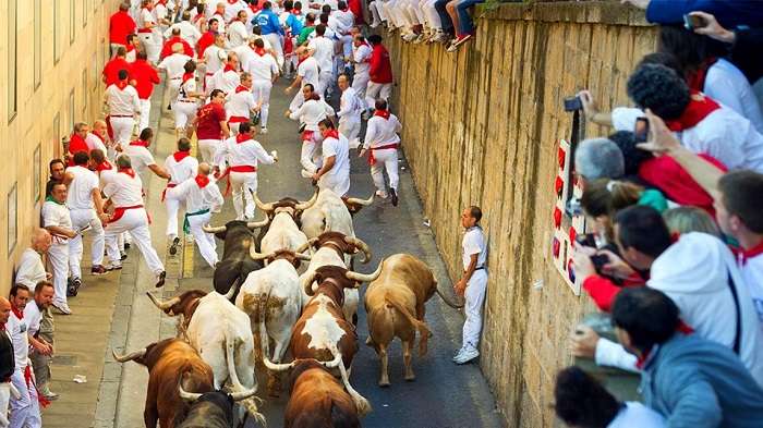 Be part of the San Fermin parade in Spain