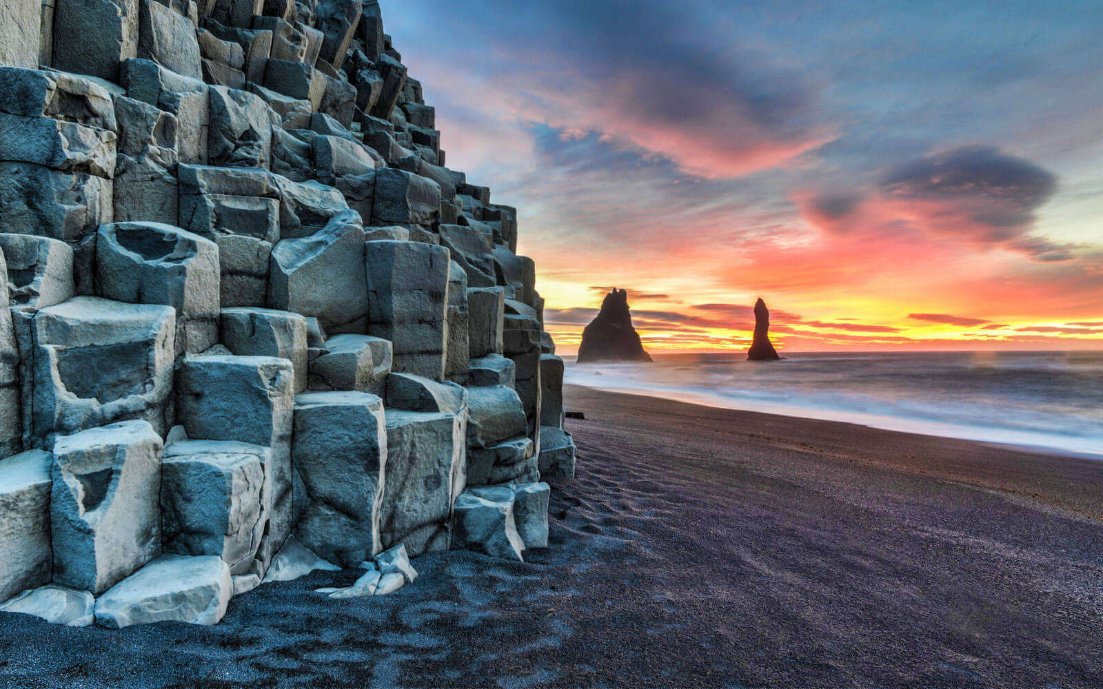 beautiful rock and black sand beach