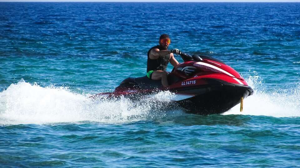 a red skiing boat in boat