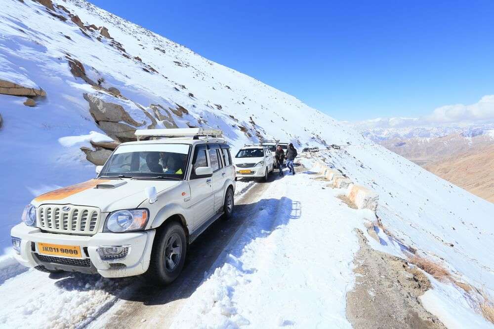 cars on snow covered changla pass