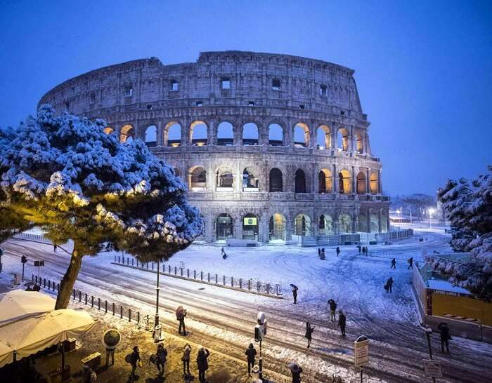 snowfall rome colosseum night