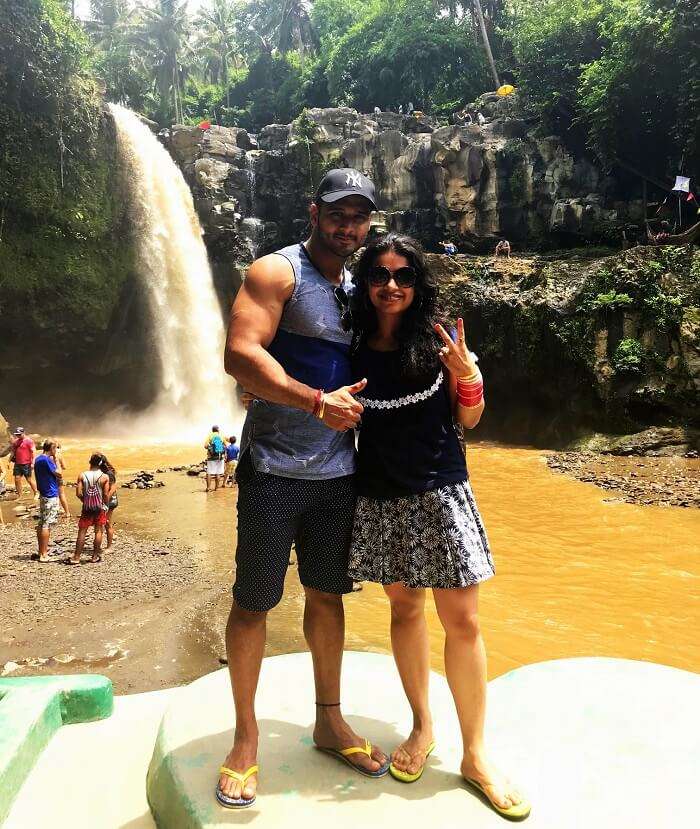 Couple near waterfall in Bali