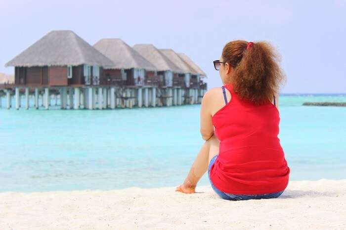 ankit wadhwa maldives honeymoon: relaxing on beach near resort