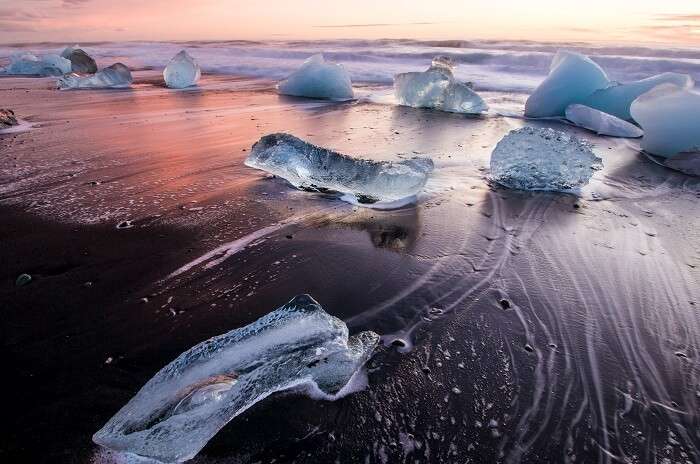 The beaches have black sand, basalt caves...and ICEBERGS