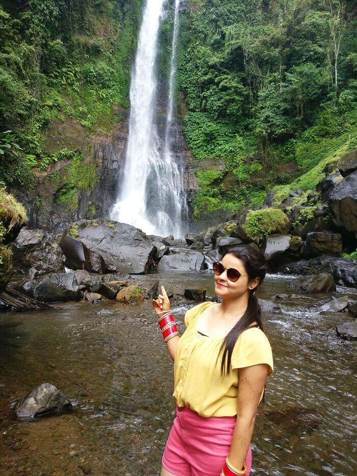 Female traveler at Gitgit waterfalls