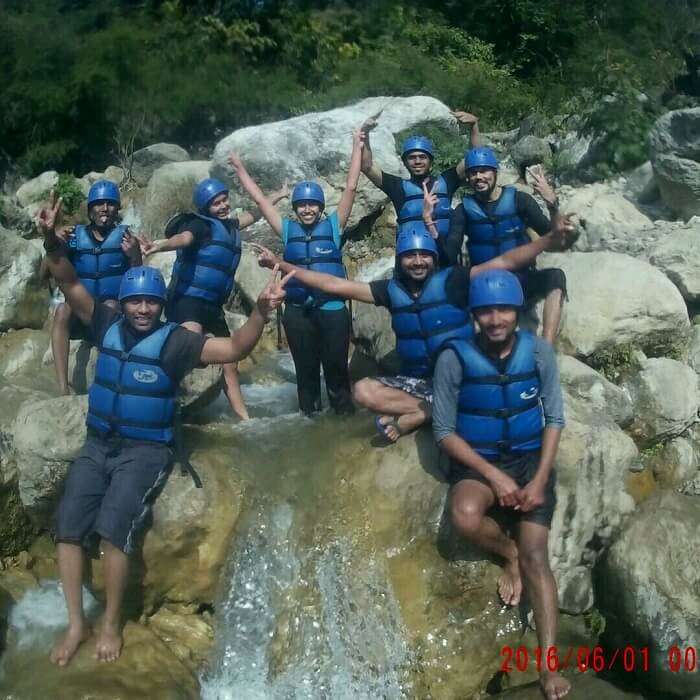 friends enjoying river rafting