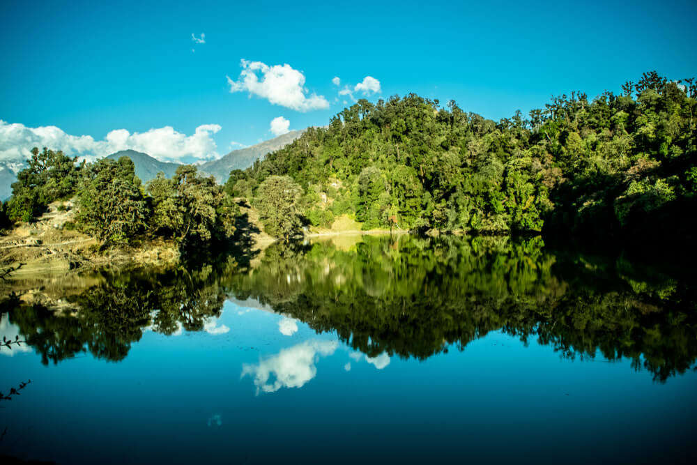 reflection of mountains on lake water