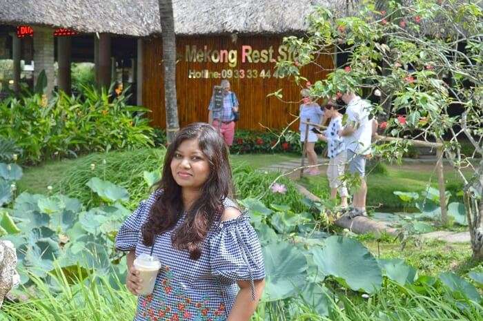 pallavi vietnam family trip: standing near mekong rest stop