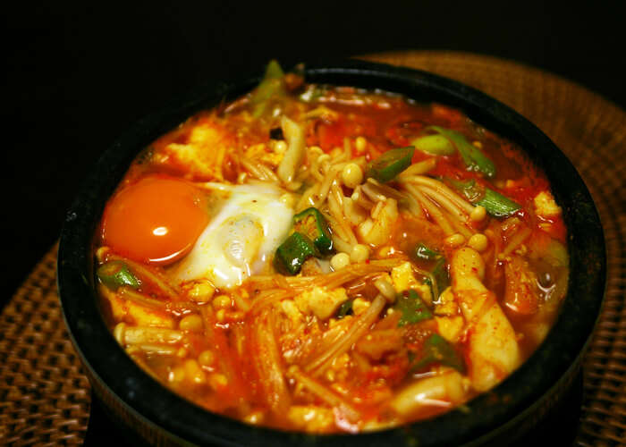 Tofu stew with beef, eggs, and veggies