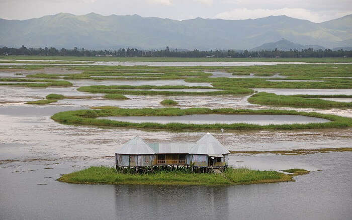 a gorgeous floating lake with a house ss01052018