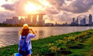 woman looking at singapore skyline in june