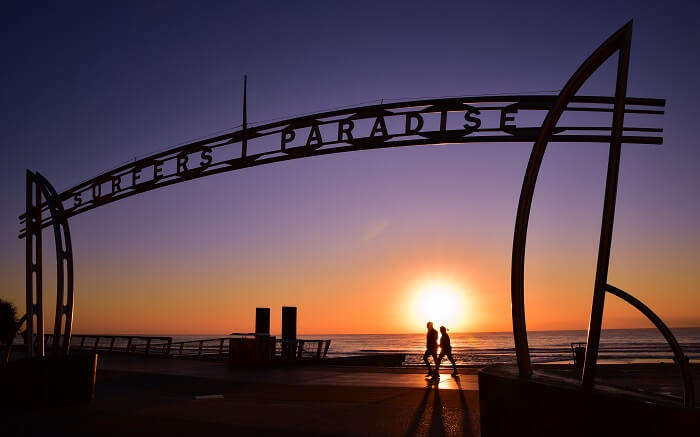 two people walking on the shores of Gold Coast beach ss01052017