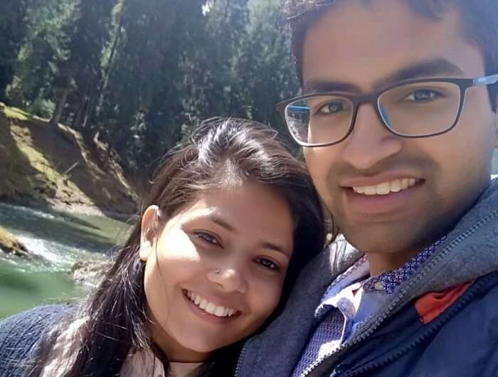 couple taking selfie near river