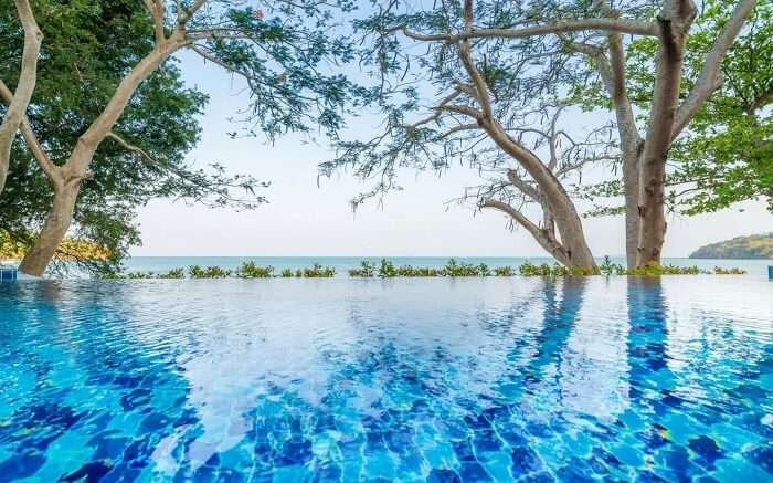 an infinity pool at Koh Sirey Beachfront Pool Villa