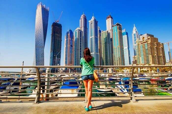 woman looking at dubai skyline