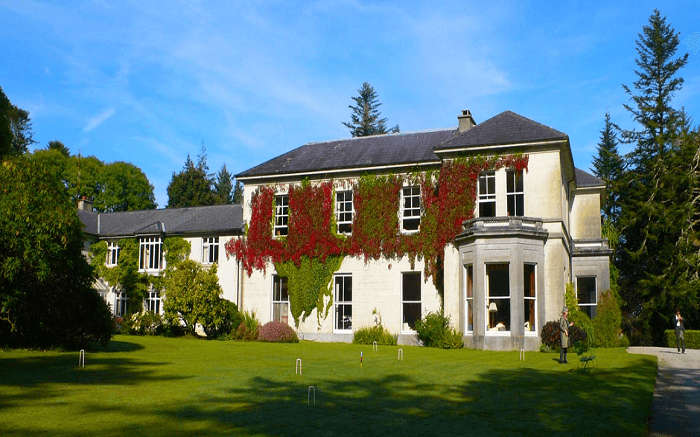 the lush lawn of Currarevagh House 