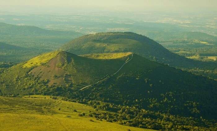 green volcanic peak in france