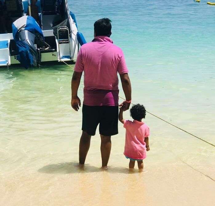 dad and kid on the beach