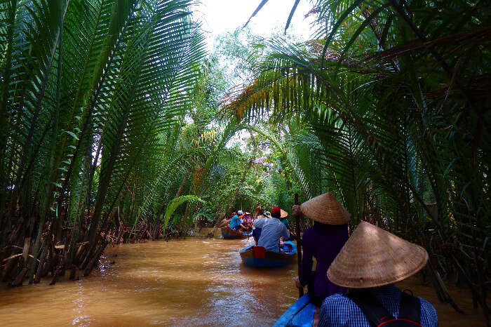 Tourists exploring Mekong River in Ho Chi Minh on boats