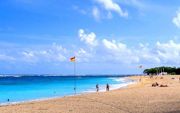 people enjoying water activities at nusa dua beach