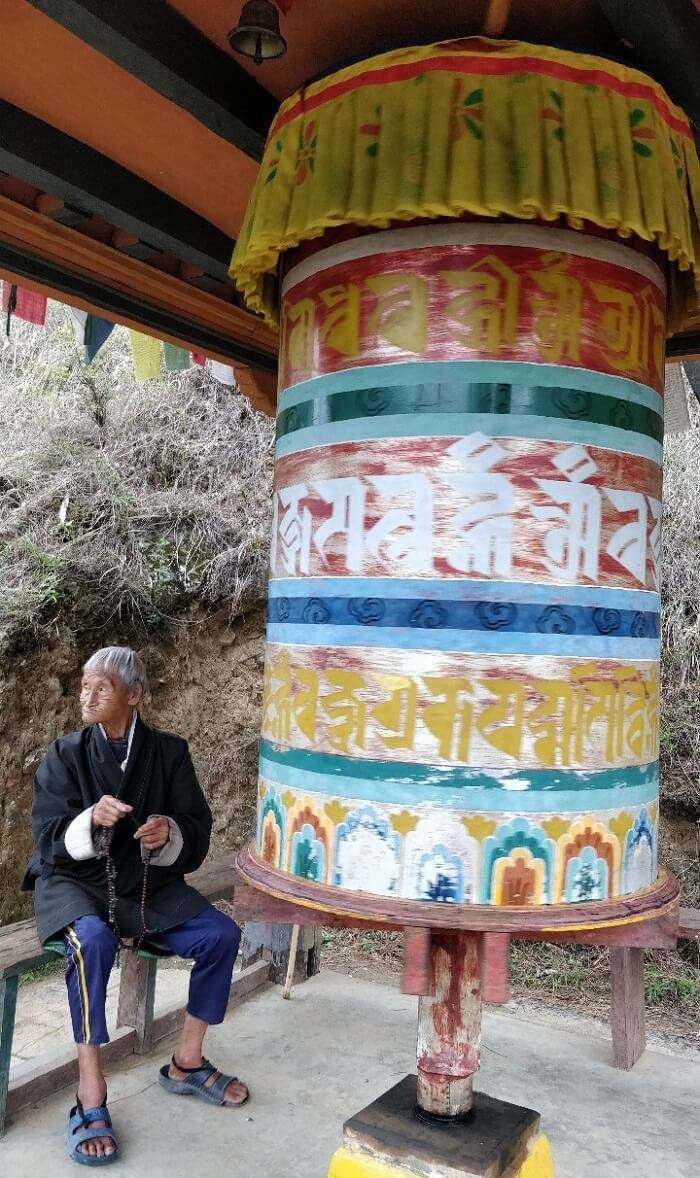 rohit bhutan family trip travelogue old man prayer wheel