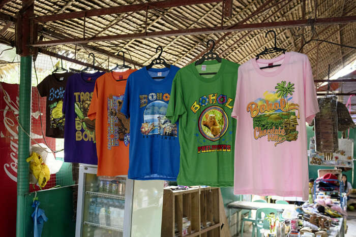Tshirts hanging for sale in a market in Bohol, Philippines