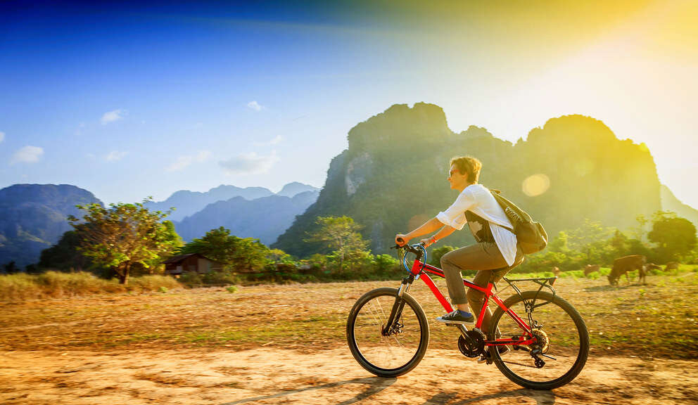 person riding bicycle in laos