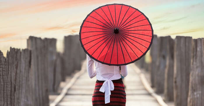 A women holding traditional Thai umbrella