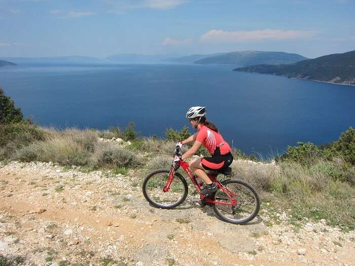 woman riding a bike across the island