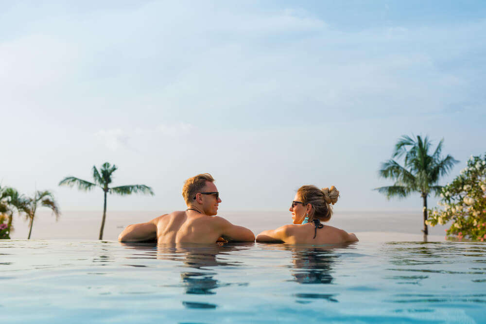 couple swimming in pool