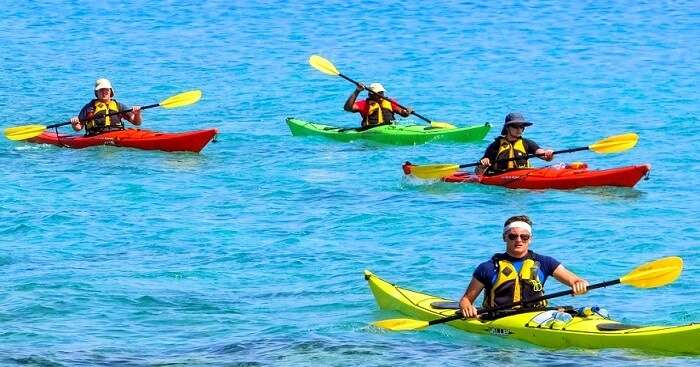 Friends rowing a kayak in Malaysian waters