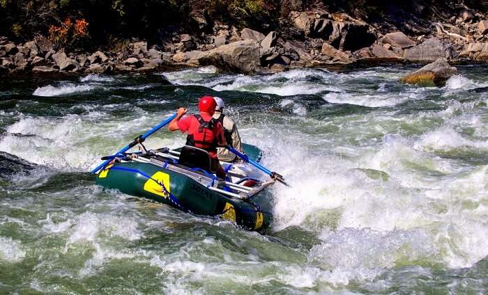 a man in water rafting