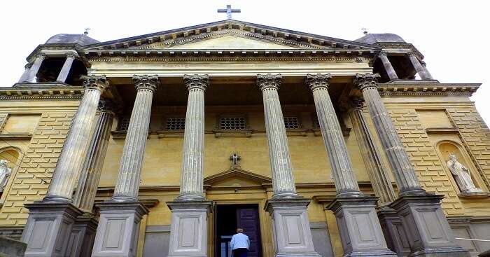 front view man entering in church