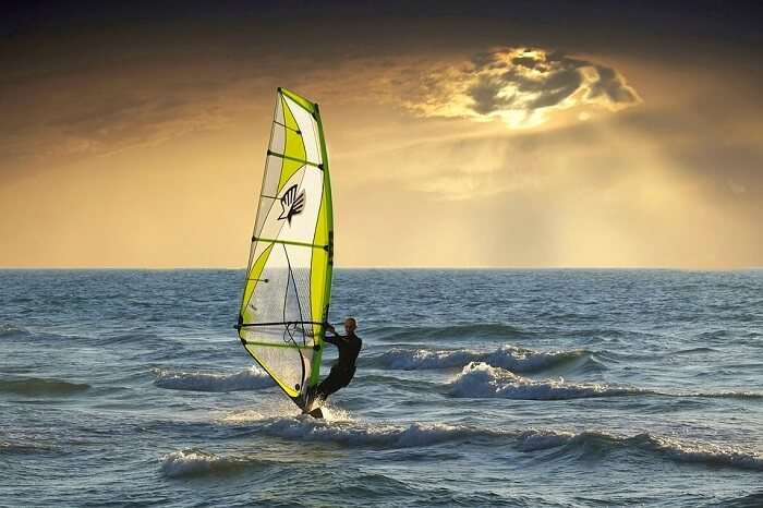 Man surfing on board in the ocean