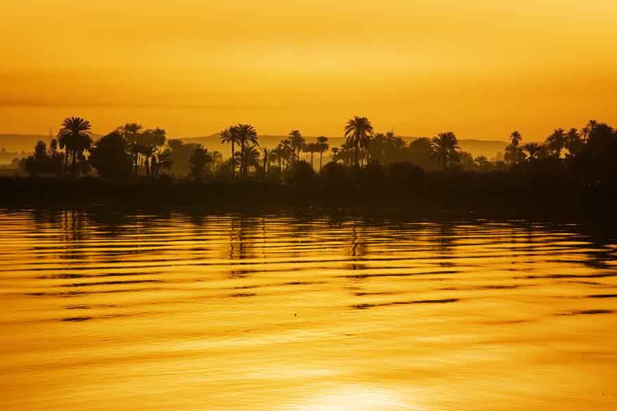 the nile painted yellow during sunset