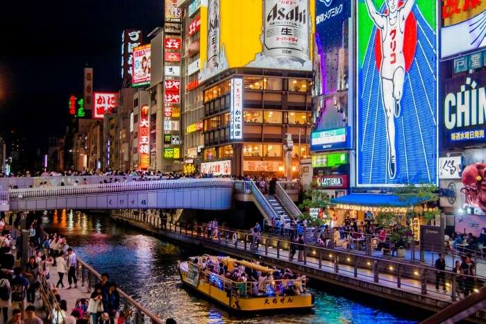 Enjoy the nightlife in the Dotonbori area of Osaka