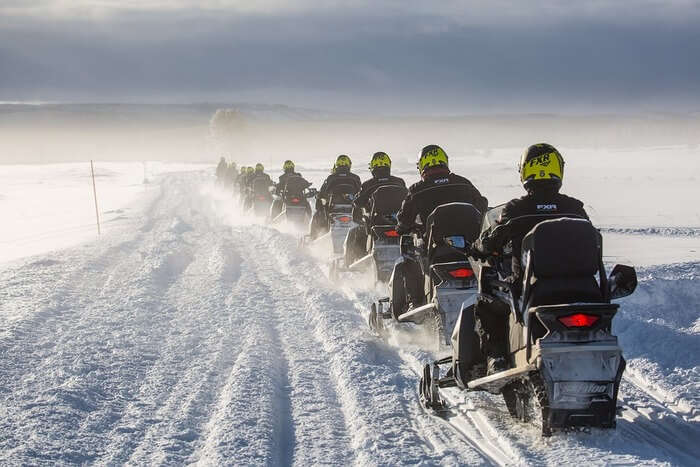 Snowmobiling in snow mountain