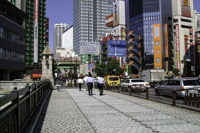 people walking across the road in Akihabara