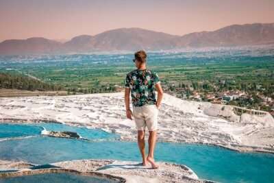 man standing viewing the famous pools