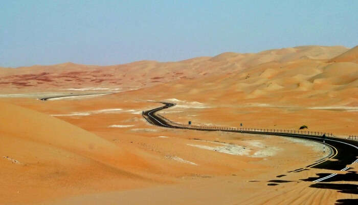 road running in the middle of a desert