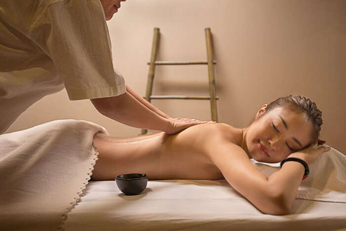 A woman undergoing massage treatment