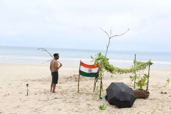 set up a camp on beach with Indian flag