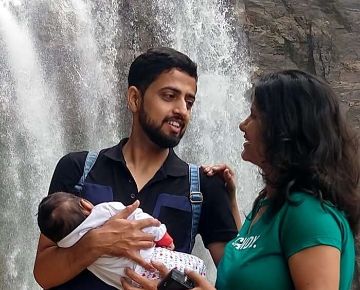 in front of the rombuga waterfall in kandy