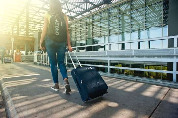 girl walking with bags