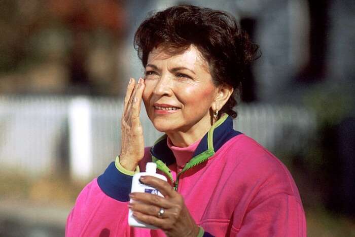 Woman applying face cream