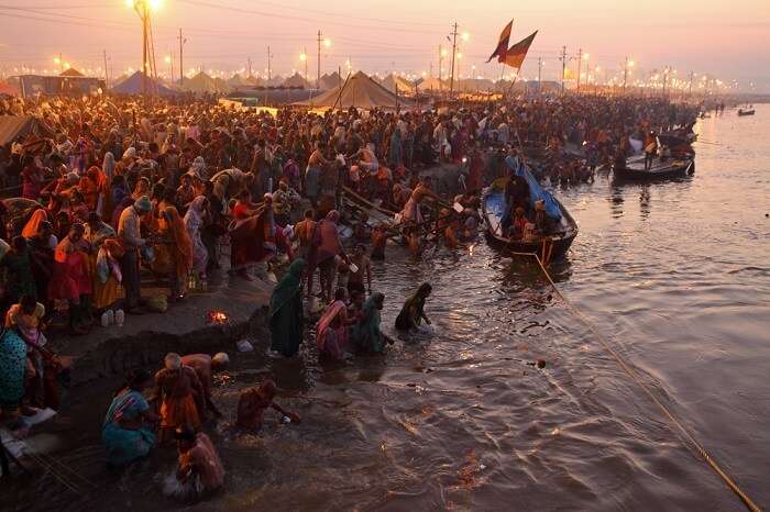 people taking a dip in holy water